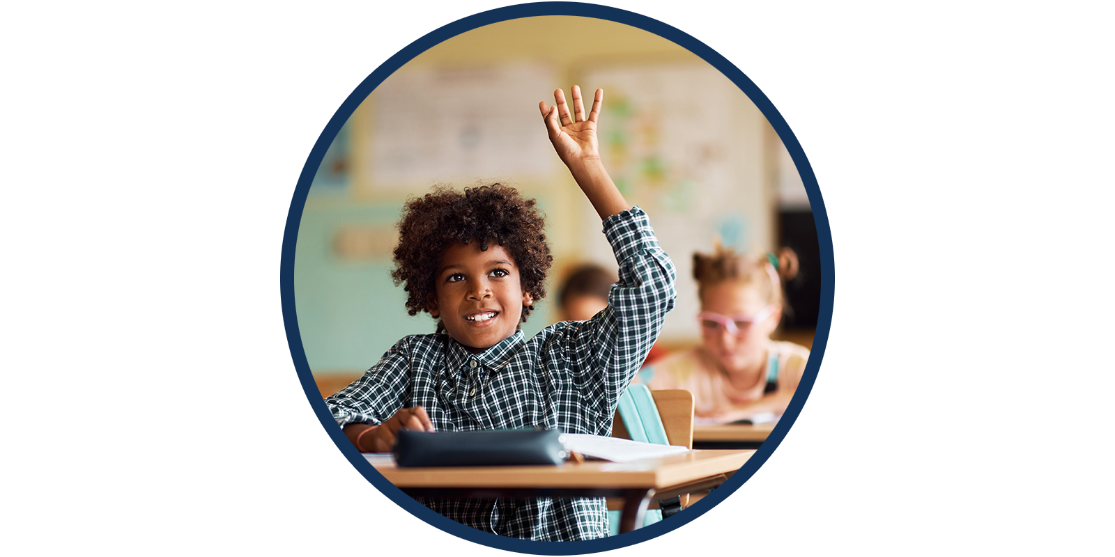 Student in classroom holding hand up